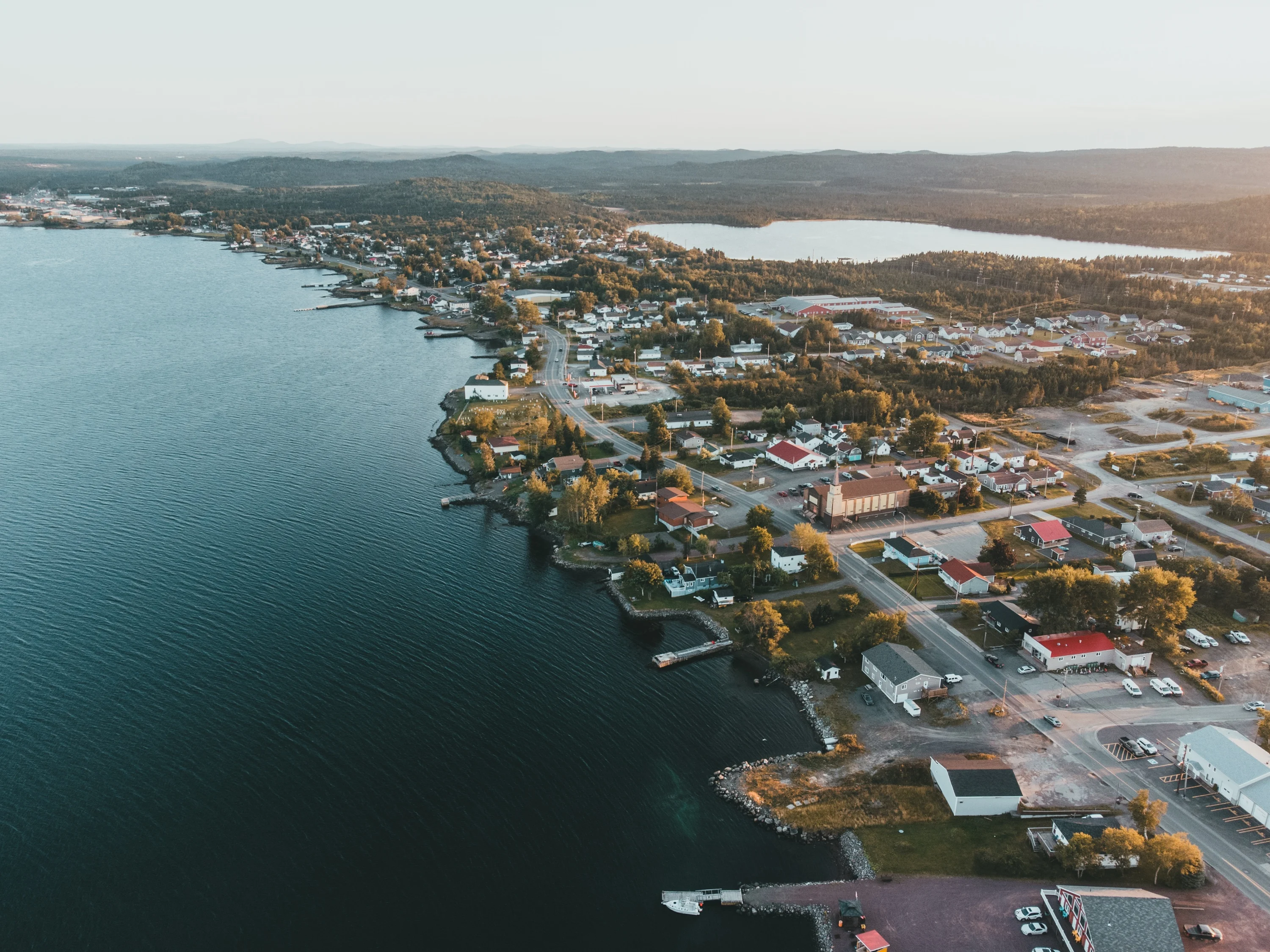 Aerial view of the Lewisporte coastline, with wooded islands and headlands stretching into Notre Dame Bay