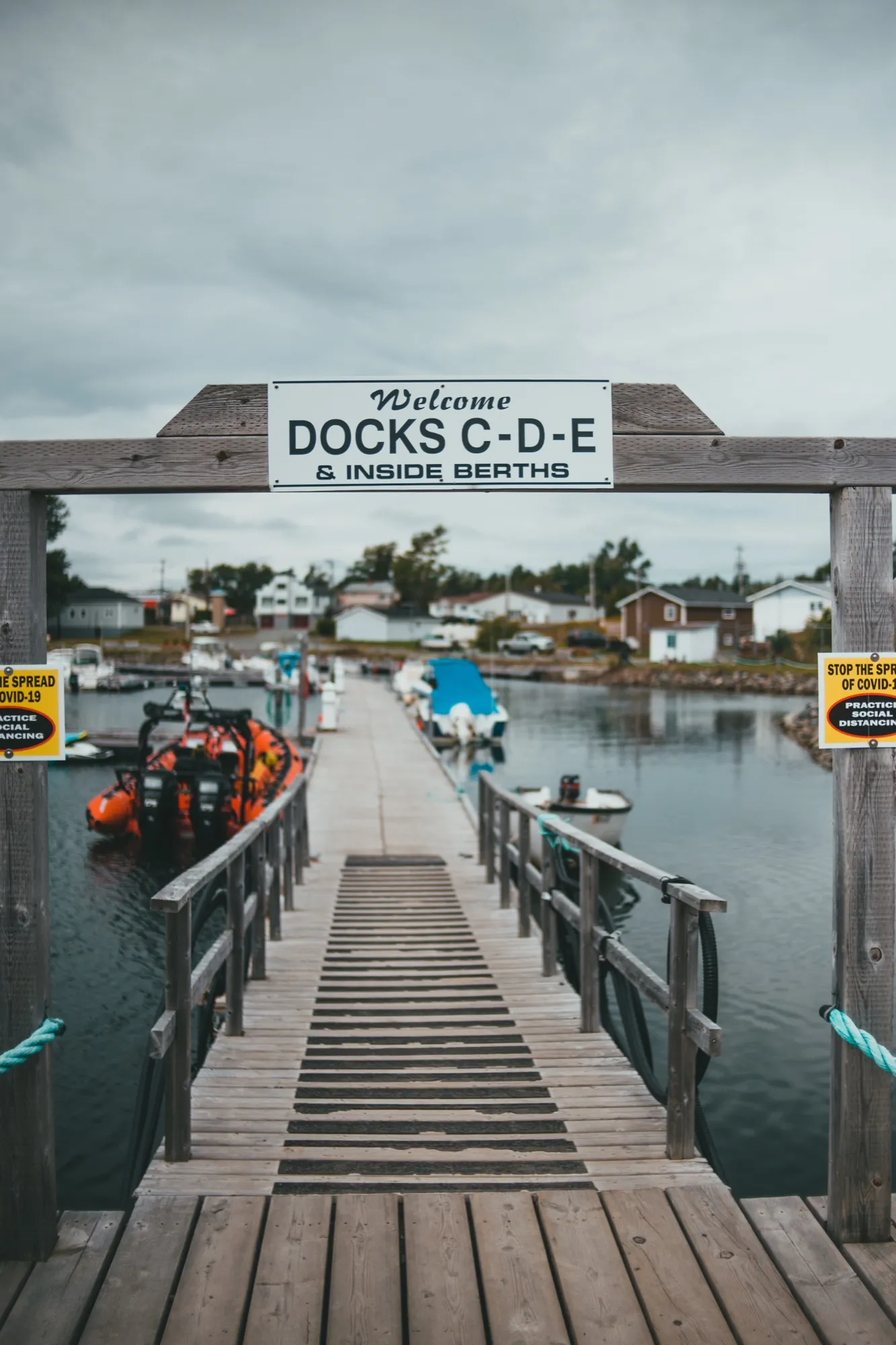 The gangway down to the marina docks beneath its overhead sign