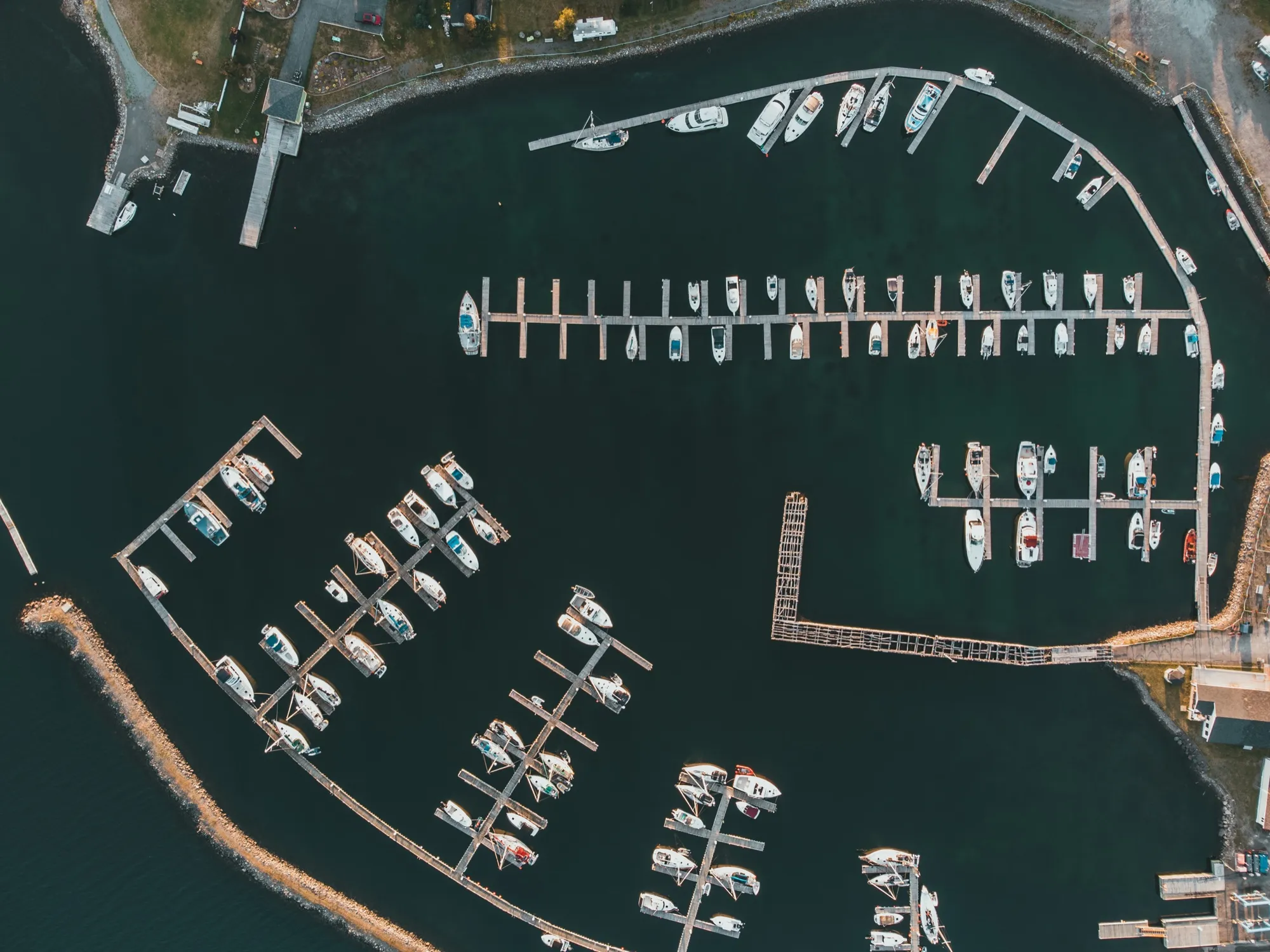 Looking straight down on Lewisporte Marina and its rows of moored boats