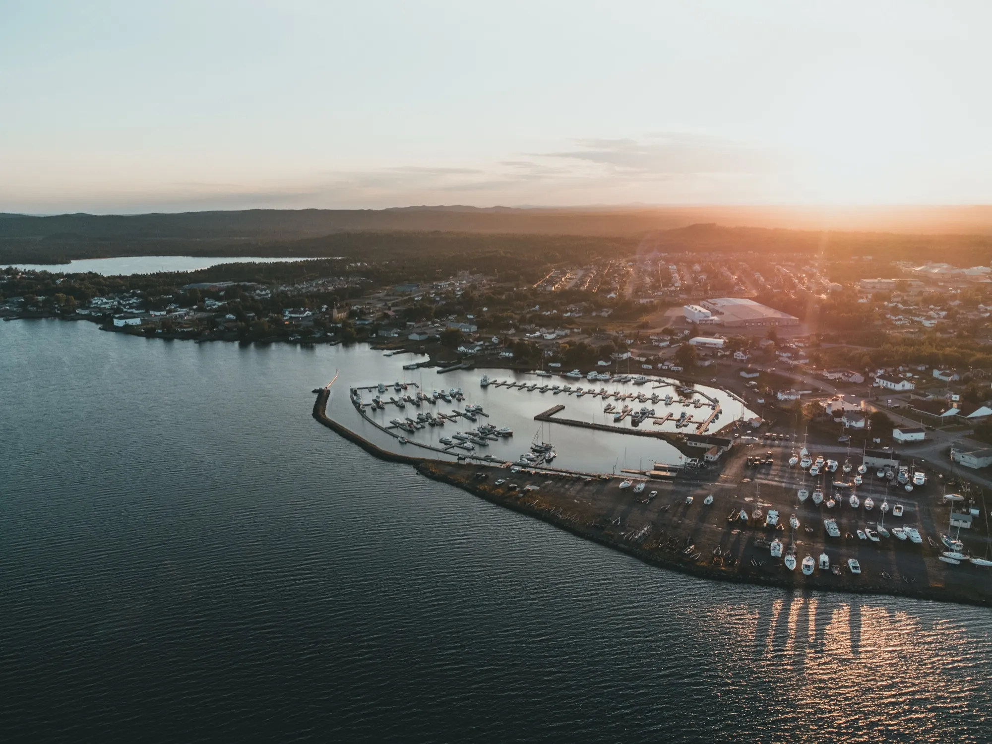 Sunset over Lewisporte, the harbour water catching the last of the light